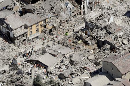Rescuers search for survivors following the earthquake that struck central Italy early this morning.