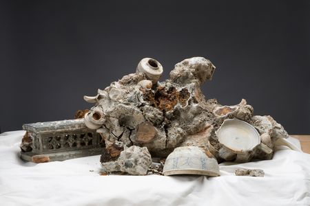 This concretion, recovered from the Hoi An shipwreck, alludes to the fate of artifacts left underwater. 