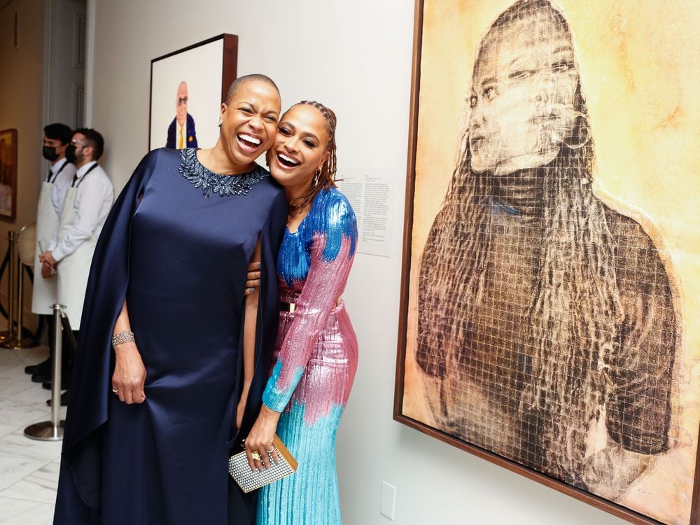 Rhea L. Combs (left) and Ava DuVernay (right) share a laugh in front of DuVernay’s portrait during the National Portrait Gallery's 2022 Portrait of a Nation Gala on Saturday, November 12, 2022.