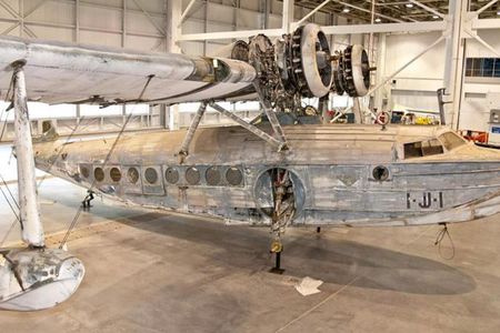 The aircraft shows traces of multiple sets of U.S. markings including the aircraft's pre-war paint scheme, and the wartime haze-blue that was applied in the days following the attack on Pearl Harbor. 