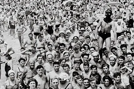 Weegee danced and screamed to get the beach crowd's attention.  The masked man called himself the Spider.