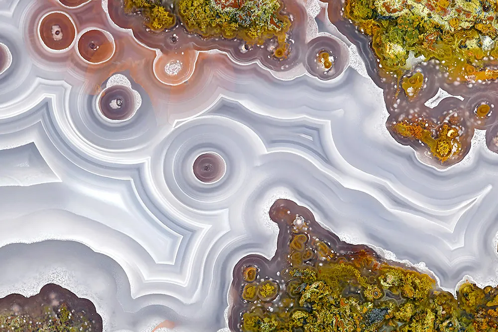 This close-up photograph reveals the hidden beauty within rocks. The mesmerizing patterns and swirls are evidence of the geological, chemical and physical tumult that occurred millions of years ago.