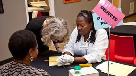Residents of Indianola, Mississippi, share stories about their family "Treasures" with curator Elaine Nichols, of the National Museum of African American History and Culture.