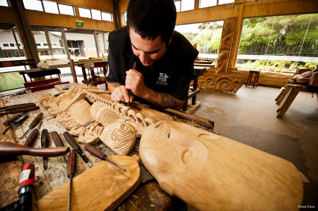 Maori artist working on traditional carving. Credit: Eric Lindberg/Tourism New Zealand