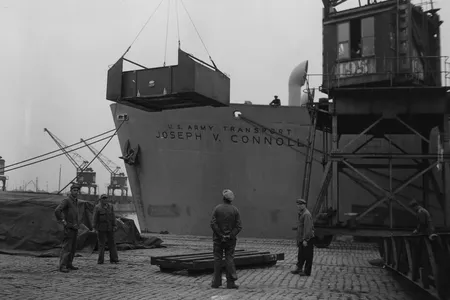 The caskets of fallen American service members are loaded onto the S.S.&nbsp;Joseph V. Connolly&nbsp;in Antwerp, Belgium, in September 1947.