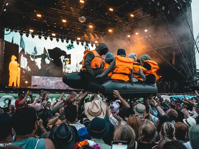 An inflatable raft appears to float through the crowd during&nbsp;Little Simz&#39;s performance at&nbsp;Glastonbury.
