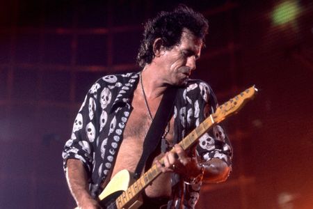 British musician Keith Richards of the Rolling Stones performs on stage during the band's 'Voodoo Lounge' tour, late 1994.