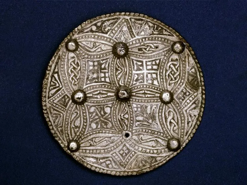Trewhiddle style silver sheet disc brooch from the Beeston Tor Hoard, discovered in 1924 by George Wilson at Beeston Tor in Staffordshire, England