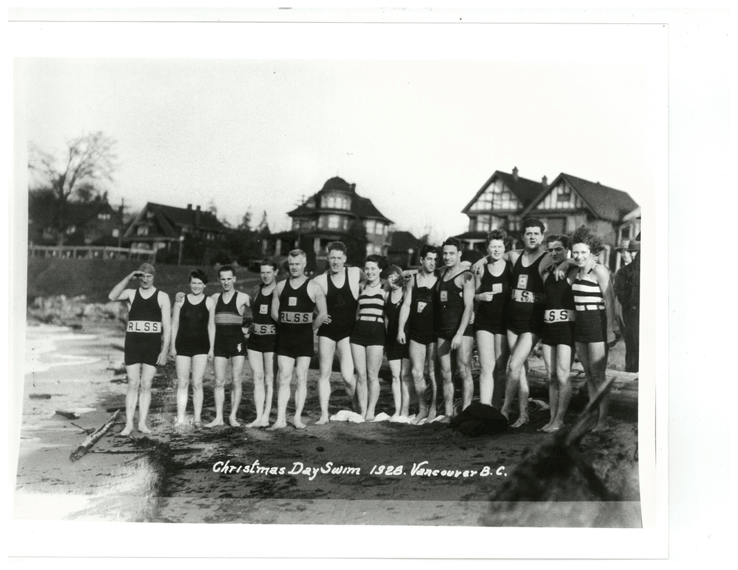 people in swimsuits in a black and white photo near a body of water