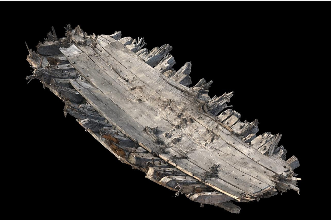Model of 16th century ship against a black background