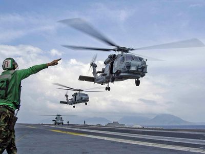 Taking off from the deck of the USS Abraham Lincoln as part of Operation Unified Assistance, Seahawks respond to the tsunami that hit Indonesia in December 2004.