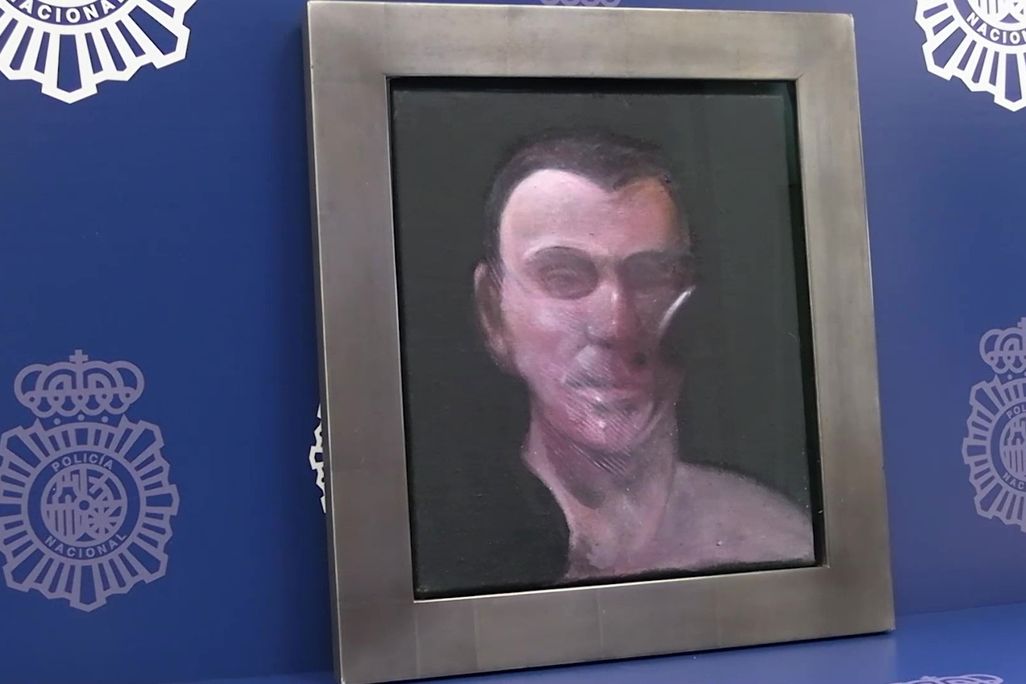 Frame painting of a man's face against a blue background