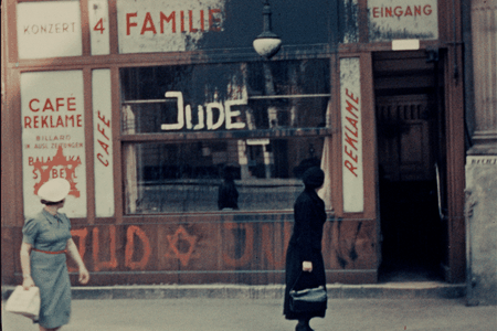 Women observe anti-Semitic graffiti in Vienna in a film shot by an American in 1938. 