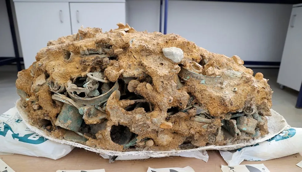 Large chunk of metal items covered in dirt