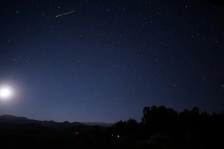 A Delta Aquarid meteor streaks across the sky.