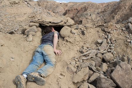 Adam Donnelly repairs light leaks inside a camera that he and David Janesko constructed in Coachella Valley, California.