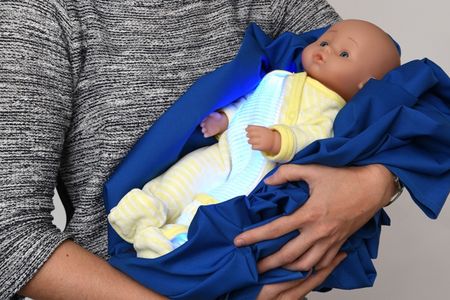 A demonstration of the technology, with the light fabric sewn into a onesie