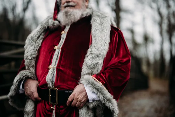 Mr Claus adjusting his outfit before his big ride. thumbnail