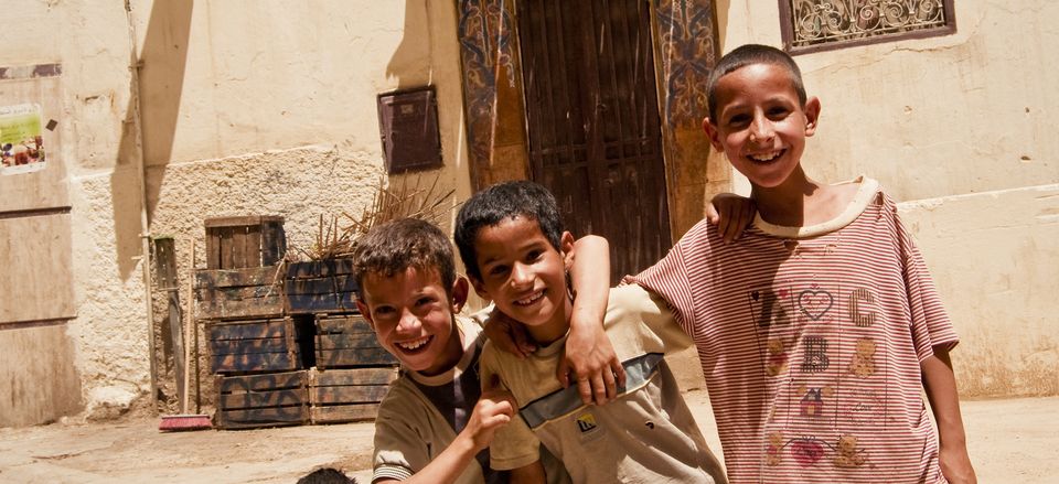  Children in Fez, Morocco smile upon meeting one of our Country Specialists. 