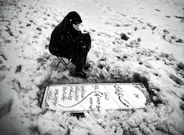 A mother at her son’s grave thumbnail