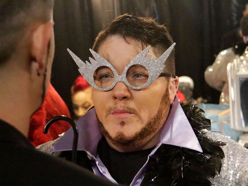 A close up of Kody's face, featuring large, sparkly, silver glasses.