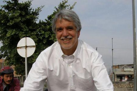 Enrique Peñalosa, former mayor of Bogota, rides a bicycle