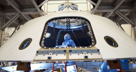 Technicans work on the Mars Science Laboratory, aka Curiosity