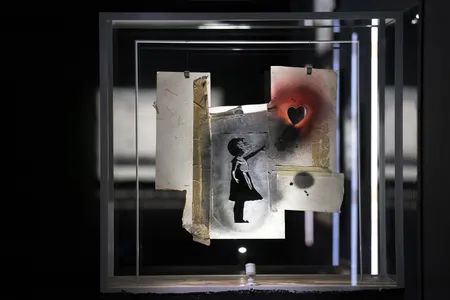 The original stencil for Banksy's Girl With Balloon is among the items on display in a new solo show at Glasgow's Gallery of Modern Art.