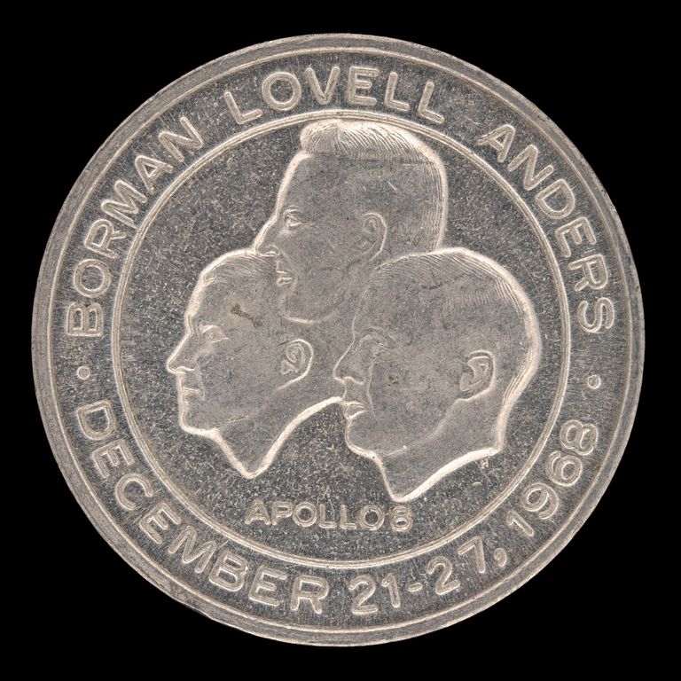 Coin with silhouettes of three men and text that reads BORMAN LOVELL ANDERS DECEMBER 23-27, 1968