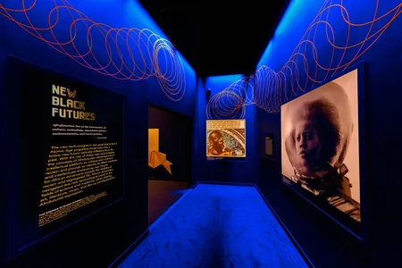 The exhibition &quot;Afrofuturism: A History of Black Futures,&quot; (above, right: A scene from the 2014 Ghanian short film &quot;Afronauts&quot;) is on view through March 24, 2024, at the Smithsonian&#39;s National Museum of African American History.