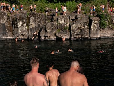 On June 27, residents flocked to the Clackamas River at High Rocks Park in Portland, Oregon, to take a dip and enjoying some cliff jumping.