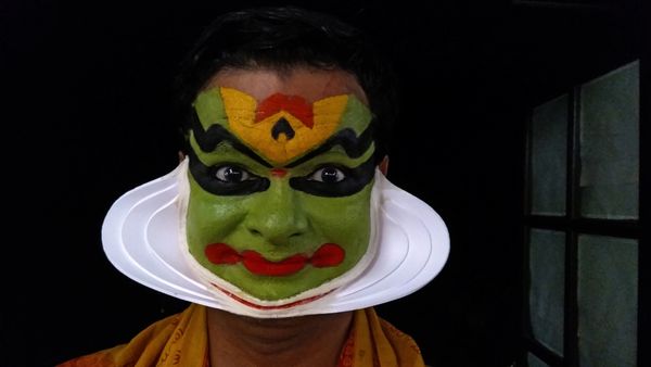 A Kathakali artist in full makeup thumbnail