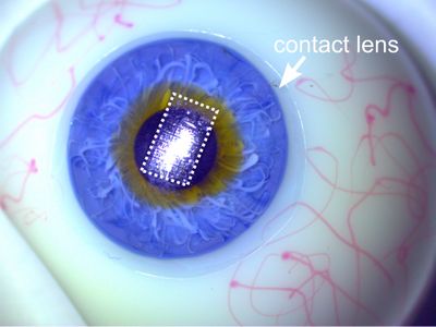 A new, ultra thin circuit, shown embedded on a contact lens placed on a prosthetic eye.
