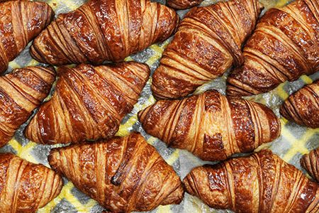 Croissants await delivery to stores inside the La Boulange Pine Street baking facility in San Francisco.