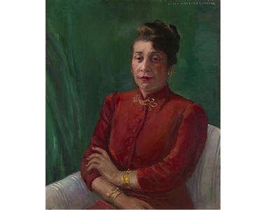 Distinguished in a high-collared, red shirt and gold jewelry, Alma Thomas wears her hair up and looks directly at the viewer. Her arms are crossed loosely, and she sits before a green background.