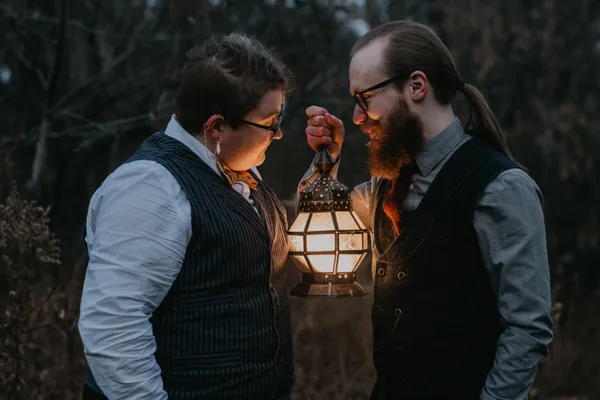 A lantern lit couple in the Minnesota forest thumbnail