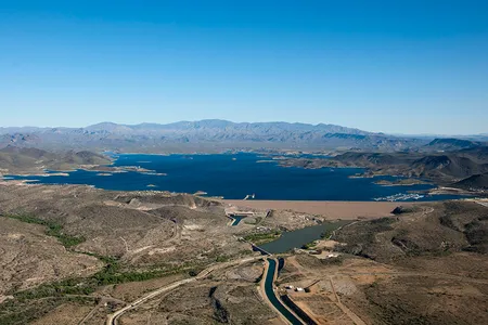 Water-strapped cities with growing populations and energy needs could benefit the most. Greater Phoenix, for instance, is served by this reservoir and irrigation system fed by the Colorado River.