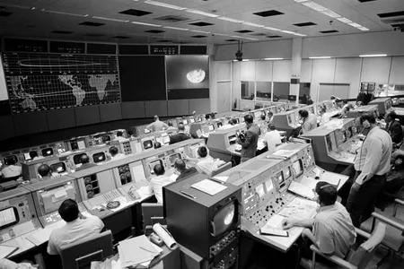 The Apollo 8 mission controllers waited on Christmas Eve, 1968, as humans flew around the moon for the first time. Courtesy University of Nebraska Press.