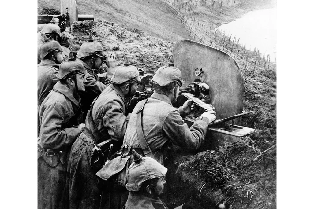 German infantrymen aim machine guns from a trench near the Vistula River in 1916.