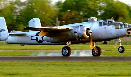 B-25J "Pacific Princess" touches down at the National Museum of the United States Air Force shortly after sunrise on April 17, 2010. The ship was one of 17 that departed Urbana's Grimes Field at two minute intervals for the short flight to the field which is part of Wright-Patterson Air Force Base in Dayton, Ohio. Four of the surviving members of the Doolittle Raiders met the aircraft. The weekend events coincide with the Doolittle Raider reunion being held in Dayton commemorating the 68th anniversary of the Jimmy Doolittle-led bombing mission to Tokyo, Japan launched from the aircraft carrier U.S.S. Hornet. "Pacific Princess", out of China, California, is owned by Carl Scholl and Tony Ritzman.