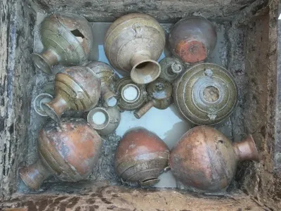 While two of the tombs were robbed, one was left untouched, and it contained a box full of glazed pottery, among other goods.