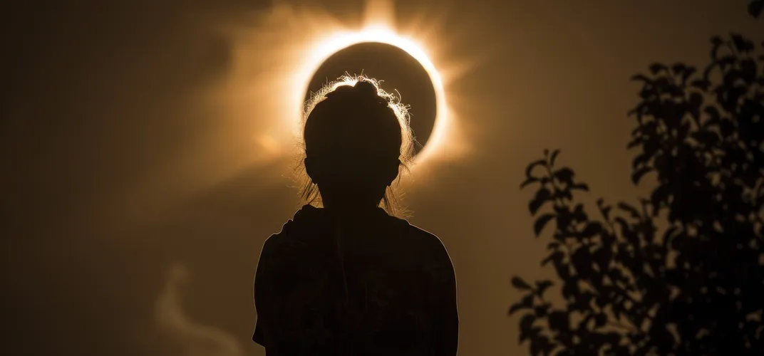 Astronomy_solar eclipse with person silhouette_ss_2446301659.jpg