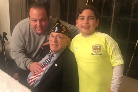 Philip Kahn, pictured on his 100th birthday with his grandson, Warren Zysman, and great-grandson