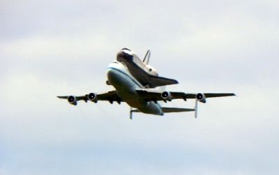 Space Shuttle Discovery flies over Washington, DC.