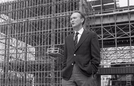 Michael Collins stands in front of the steel skeleton of the new National Air and Space Museum in July 1974
