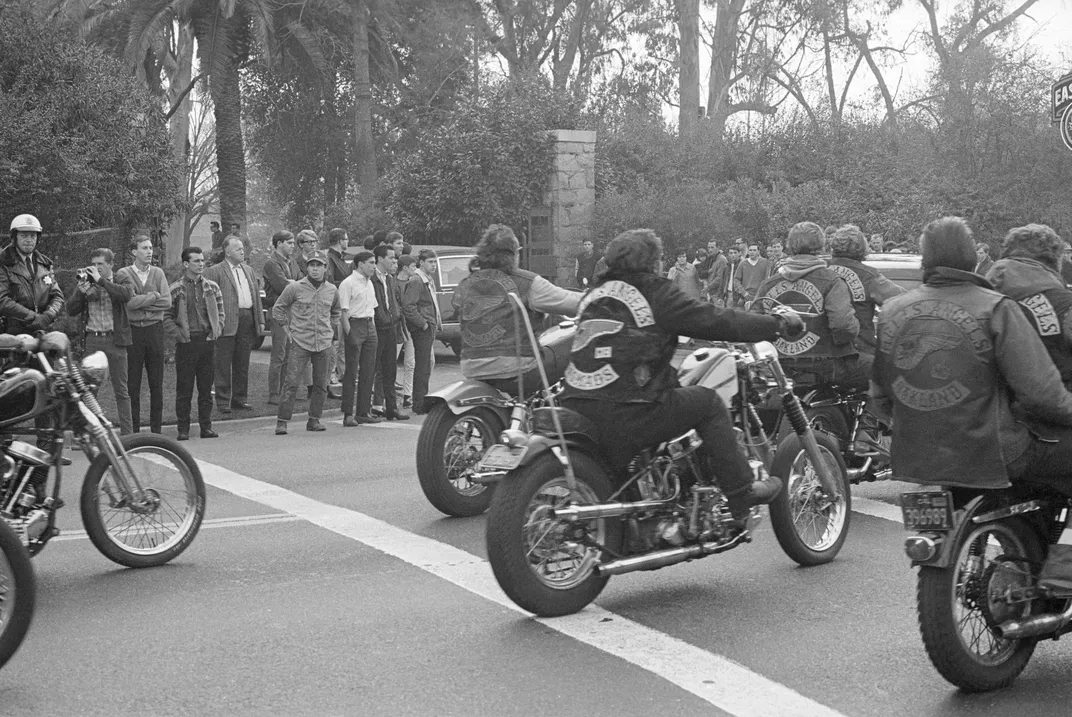 Members of Hells Angels rounding a corner on their motorcycles in 1966