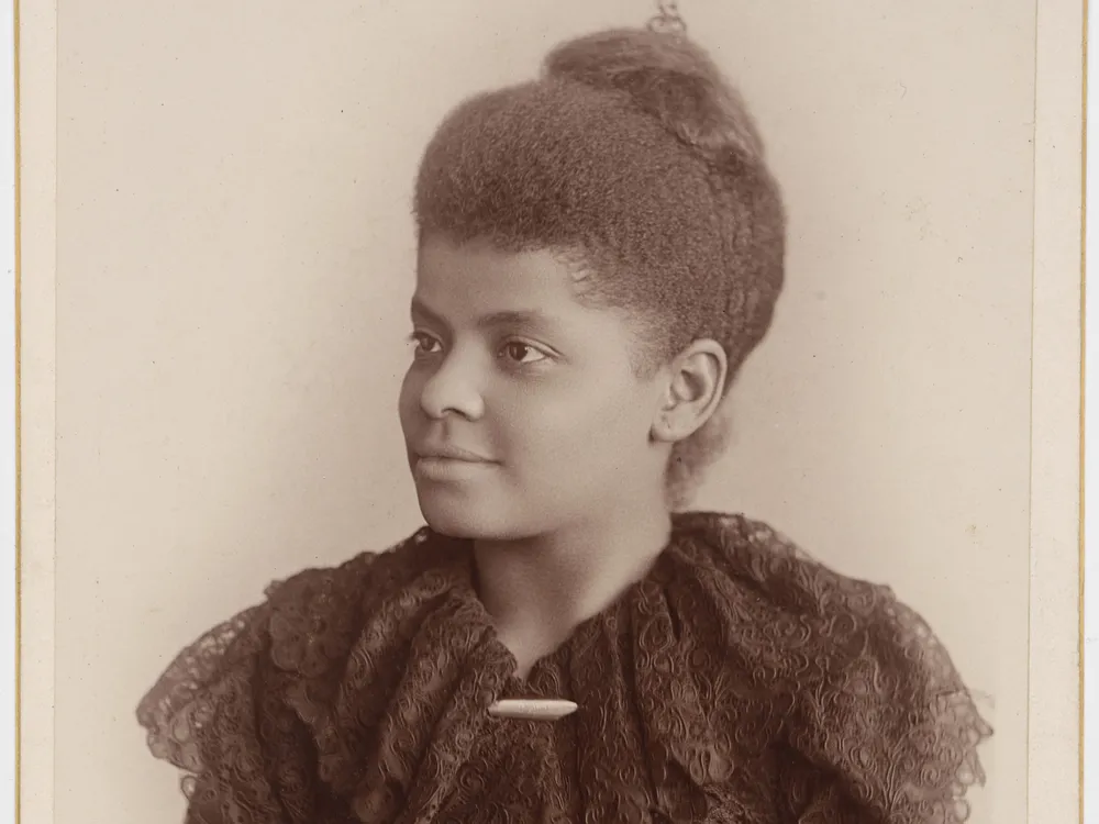 Portrait of Ida B. Wells from the waist up in 3/4th profile.