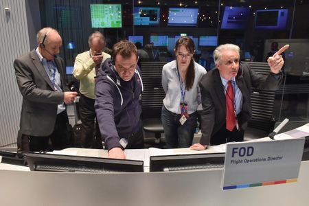 Stephan Ulamec, Fred Jansen, Andrea Accomazzo, Elsa Montagnon, and the author monitor telemetry from Rosetta the morning of the historic landing.     