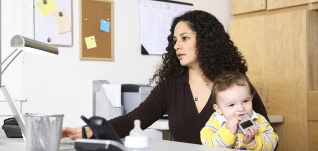 Woman at work with her child