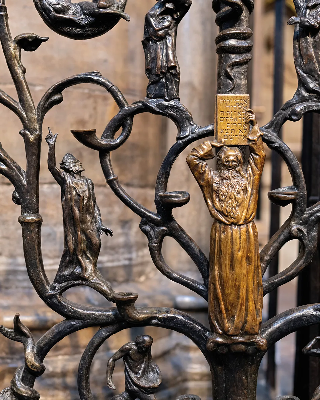 Detail of a six-foot-tall bronze candelabra